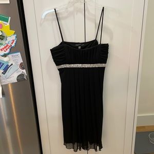 Large black cocktail dress. Brand is City Triangles